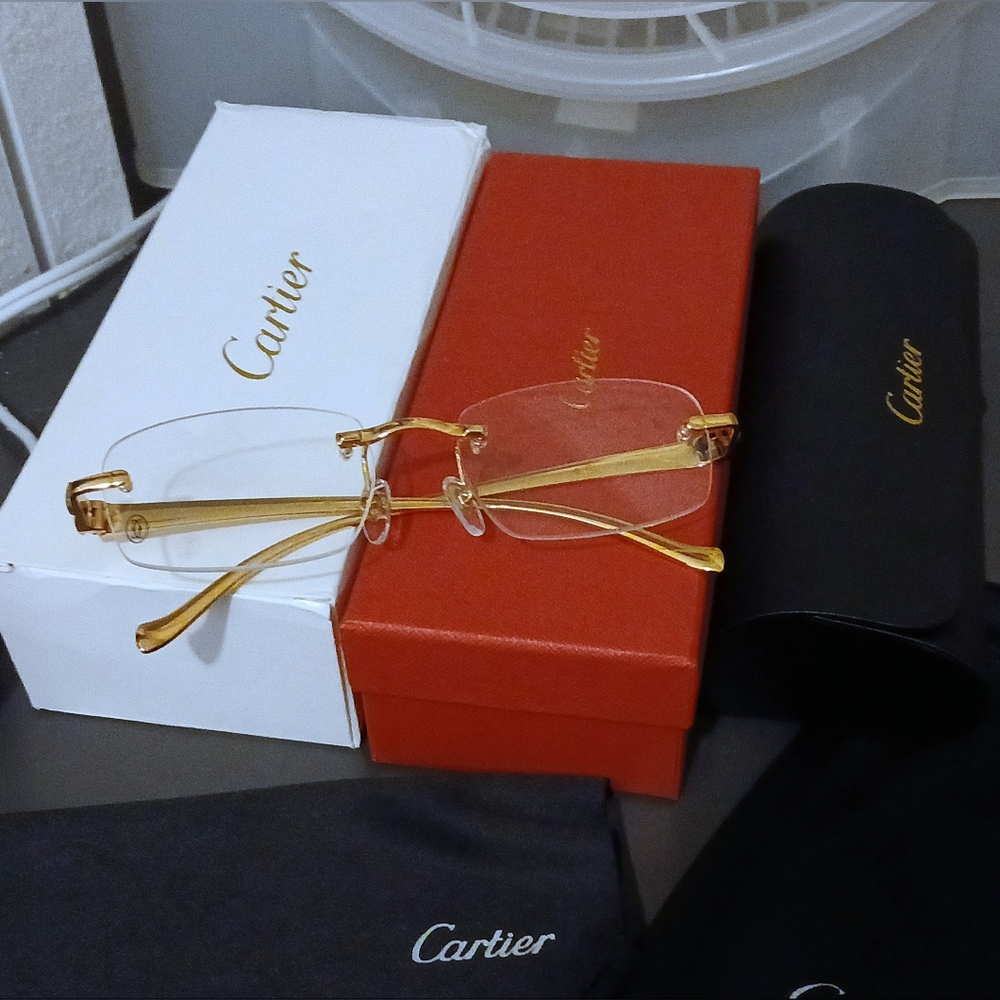 Cartier gold frame glasses. CT0061O. Rimless.